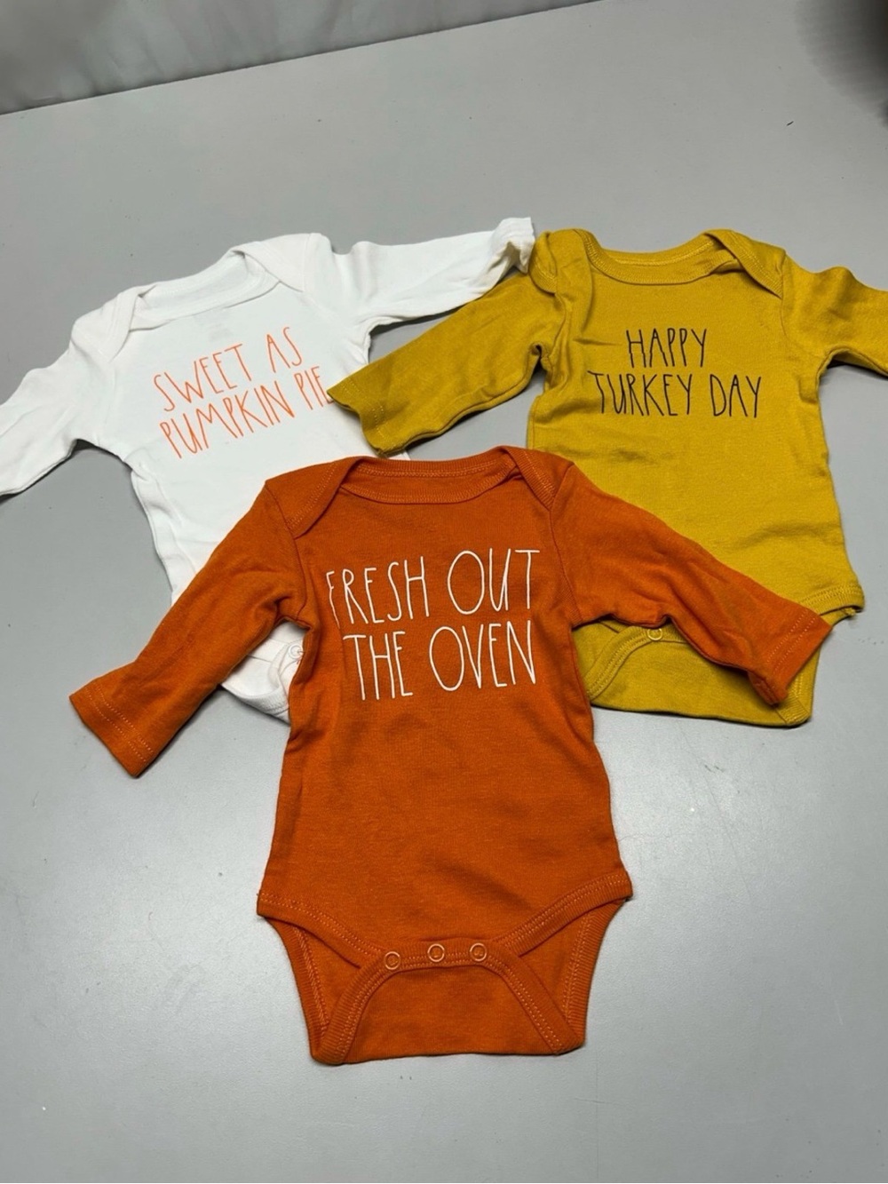Rae Dunn onesies fall White, Orange, and Mustard
